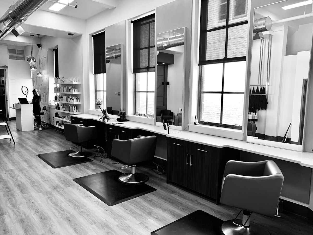 Bright modern beauty salon interior with styling chairs