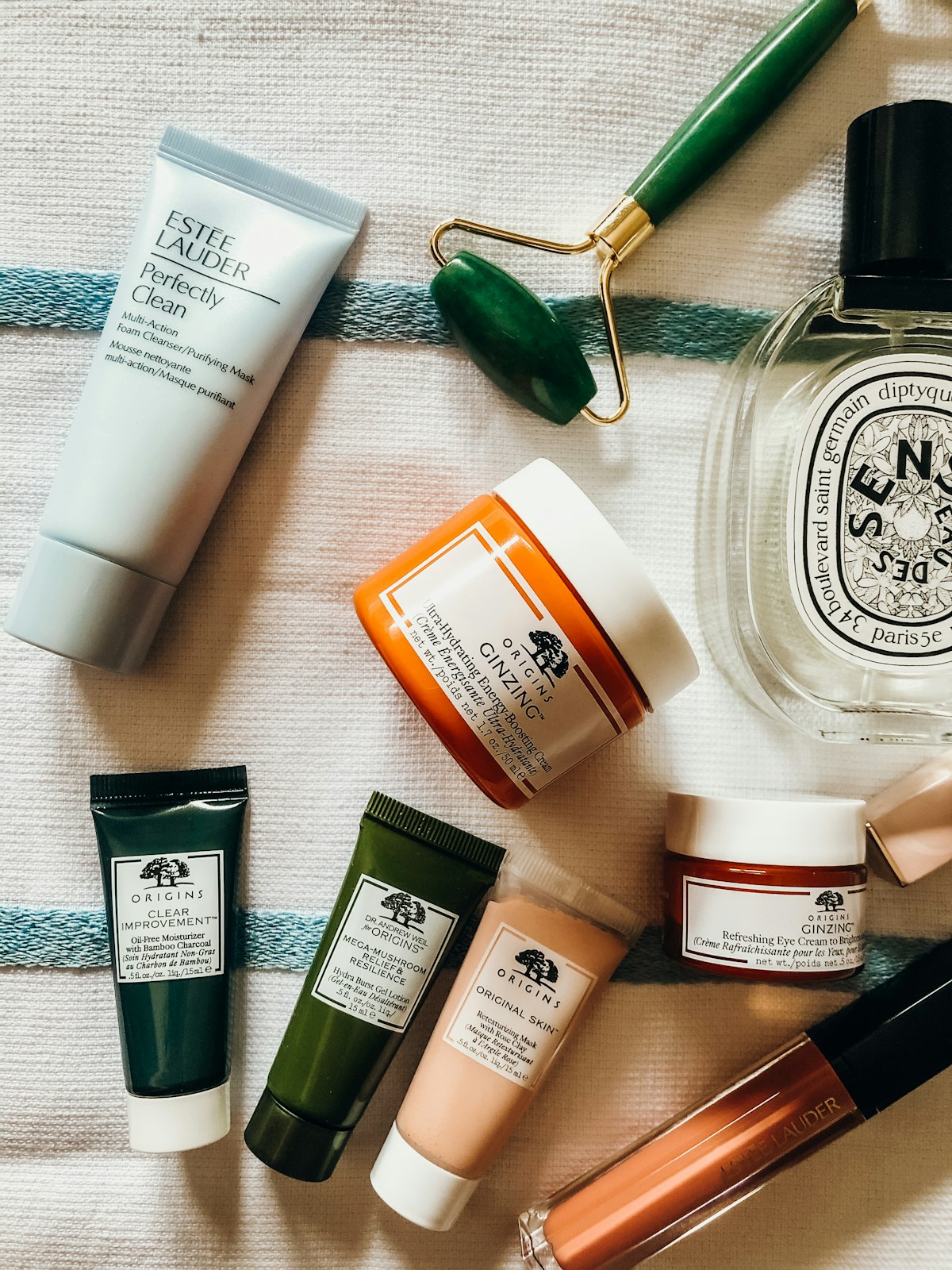 Close-up of hands holding a skincare product while reading its label