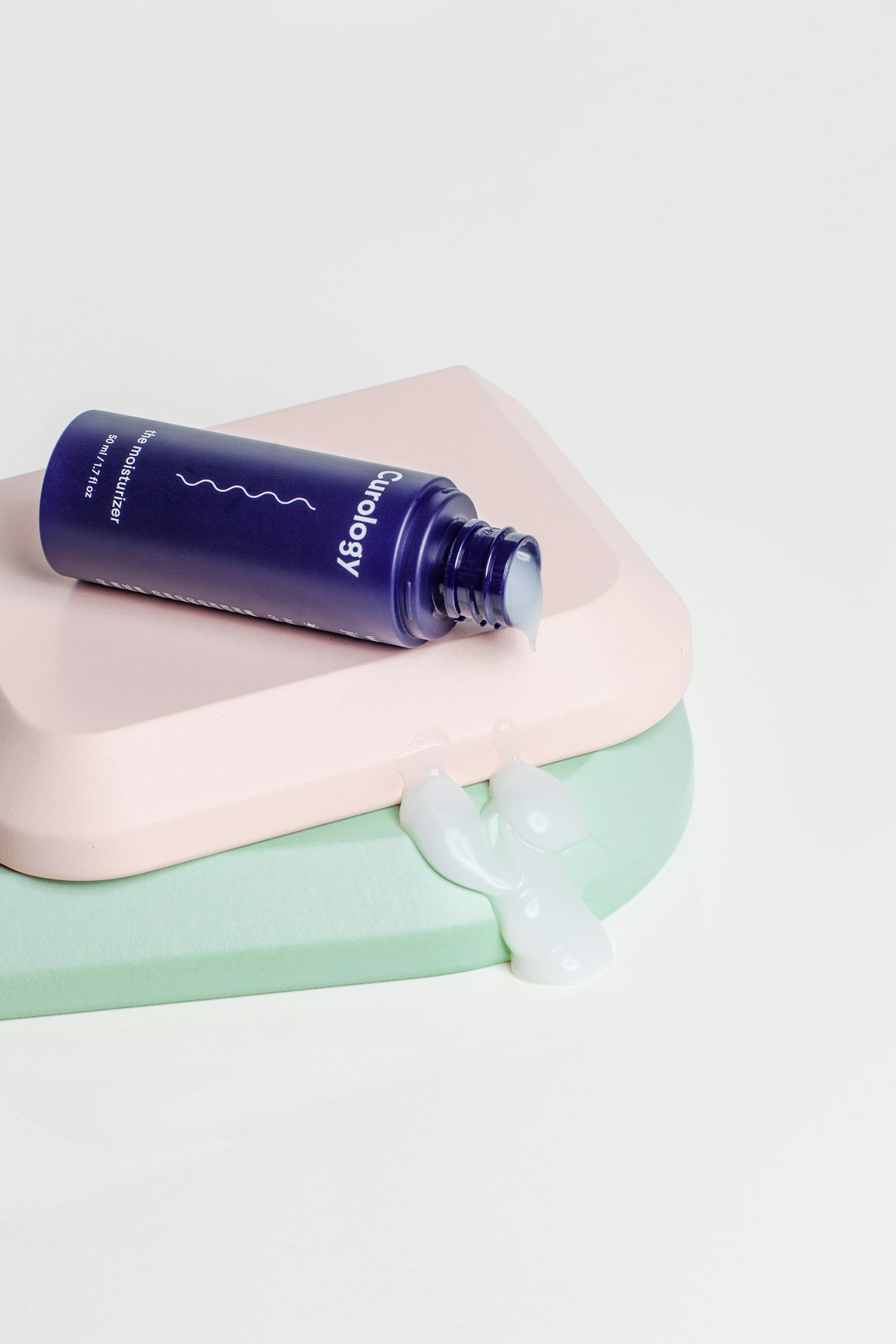 Skincare bottle on a clean bathroom shelf with soft daylight
